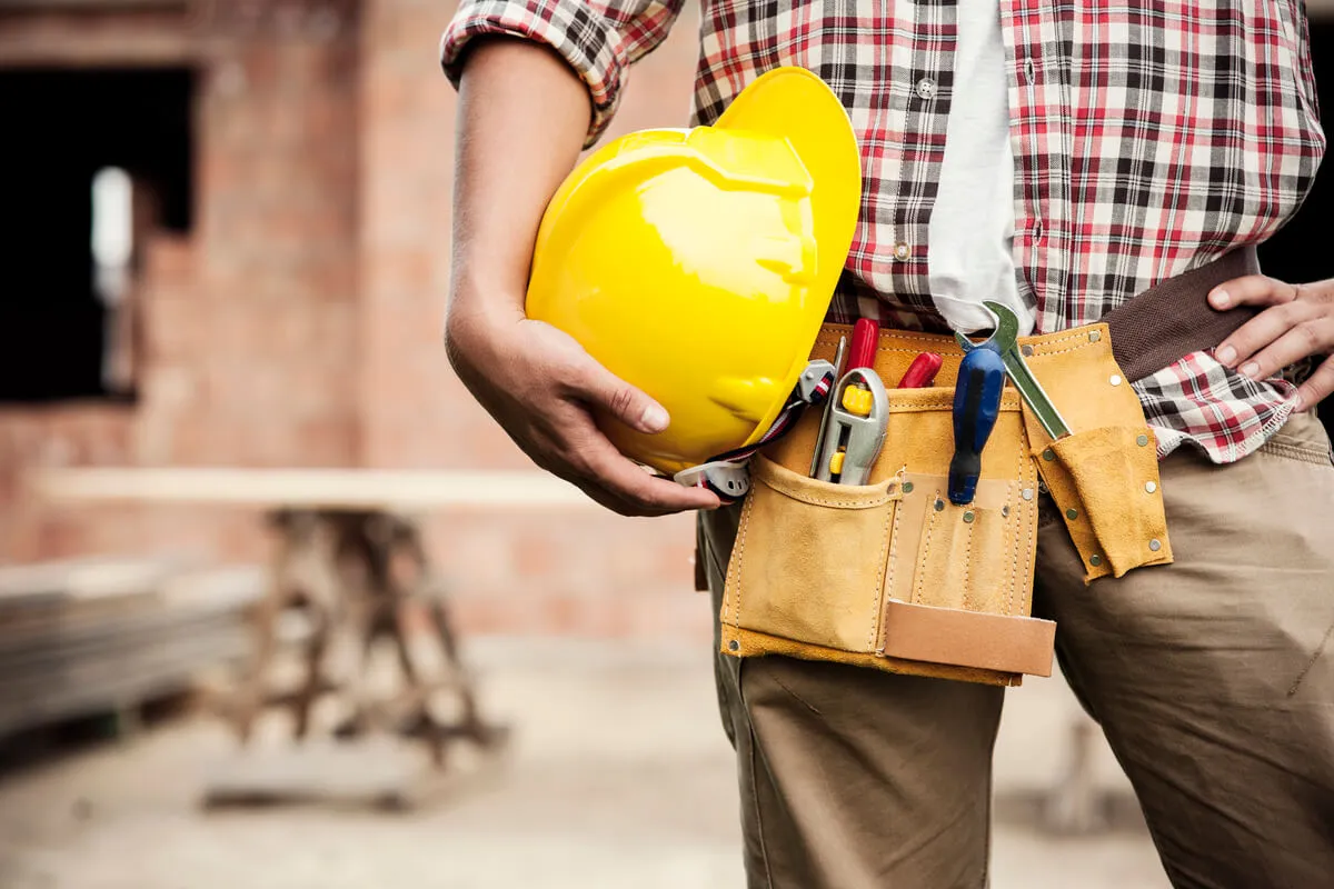 A General Contractor holding safety helmet